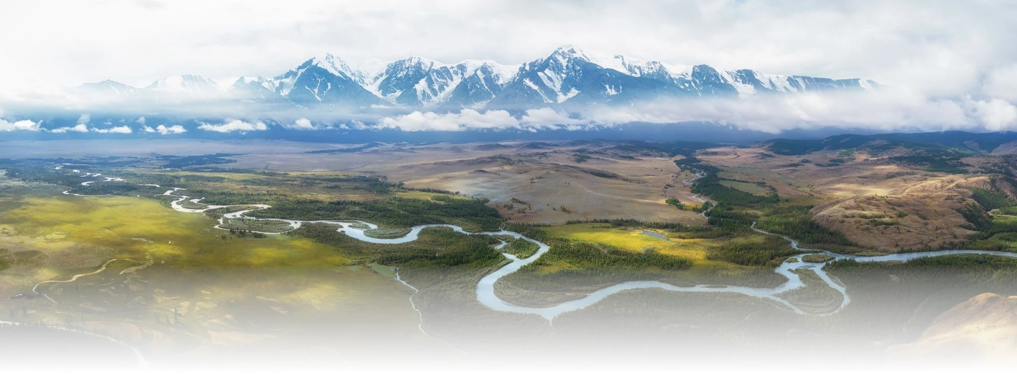 Image showing a heterogeneous landscape with rivers, forest, grassland, marsh, and mountains with shallow and deep clouds