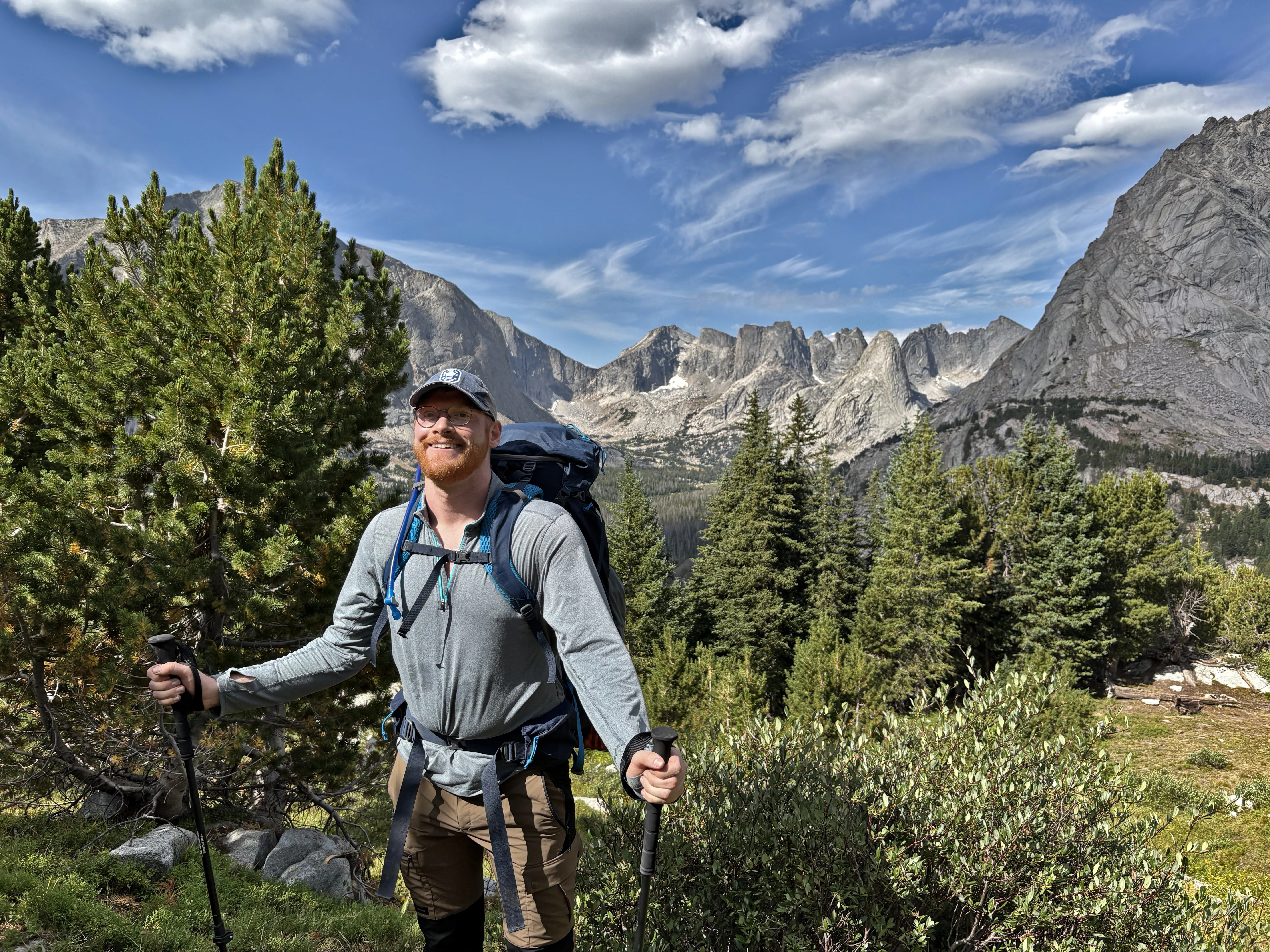 Image showing Dr. Waterman in the field in a heterogeneous landscape with rivers, forest, grassland, marsh, and mountains